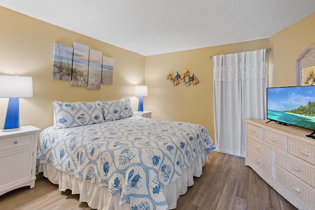 bedroom featuring wood finished floors