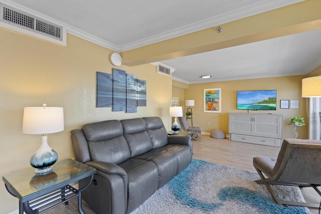 living room with crown molding, wood finished floors, and baseboards