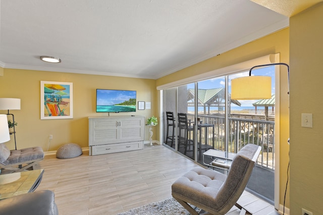 living room with light hardwood / wood-style flooring and crown molding