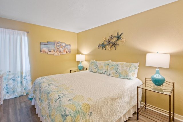 bedroom featuring wood finished floors