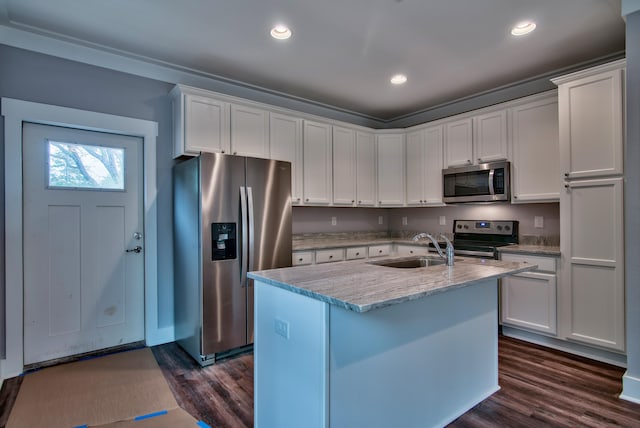 kitchen with white cabinetry, appliances with stainless steel finishes, and dark hardwood / wood-style floors