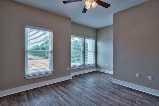 unfurnished room with ceiling fan and wood-type flooring