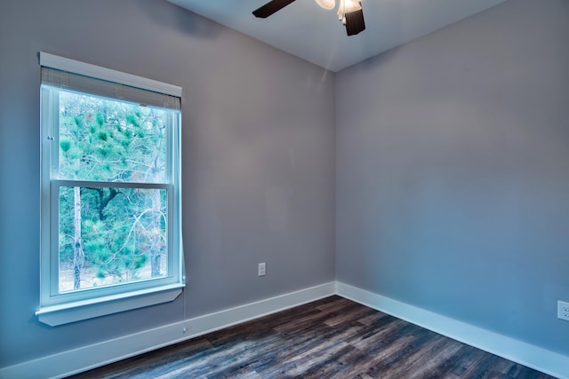 spare room featuring ceiling fan, hardwood / wood-style floors, and plenty of natural light