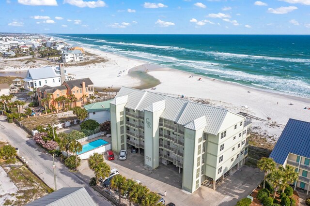 bird's eye view featuring a beach view and a water view