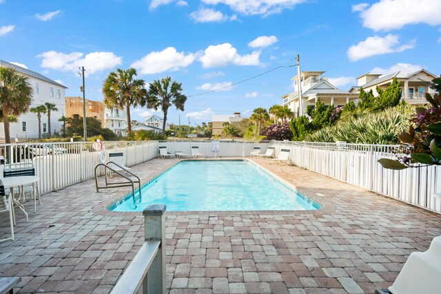 view of swimming pool featuring a patio area