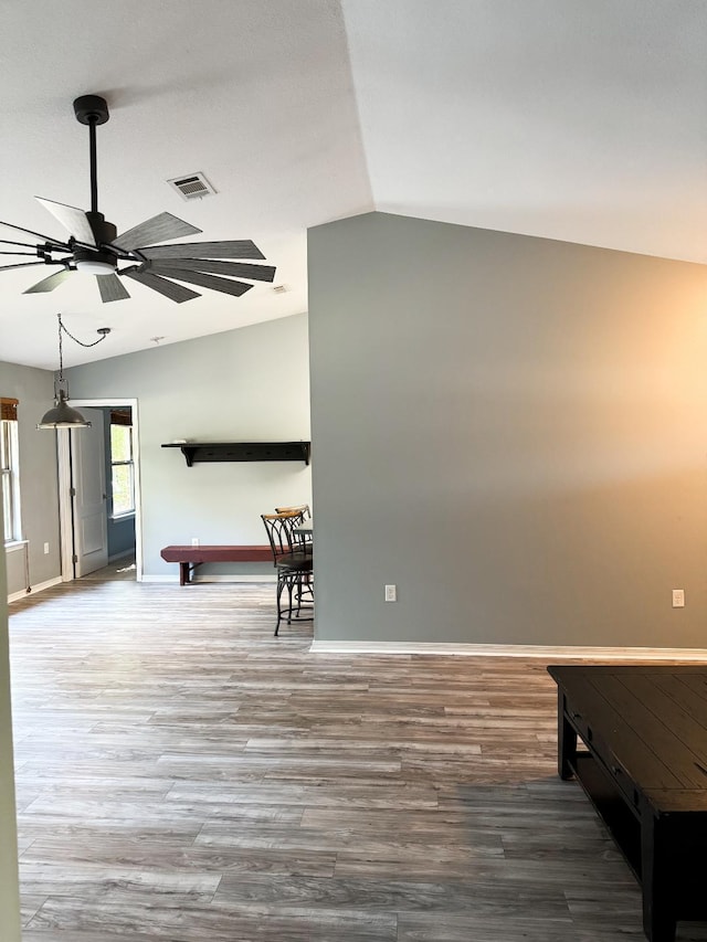 interior space with vaulted ceiling and wood-type flooring