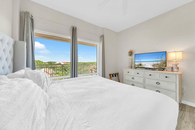 bedroom with ceiling fan and light wood-type flooring