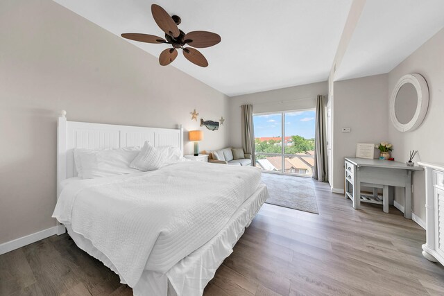 bedroom featuring hardwood / wood-style flooring, access to exterior, and ceiling fan