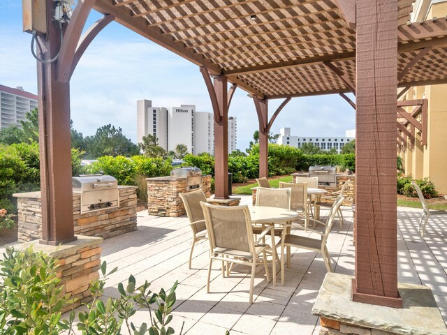 view of patio with a pergola and exterior kitchen