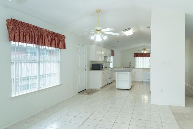 kitchen with white cabinets, white appliances, a wealth of natural light, and ceiling fan