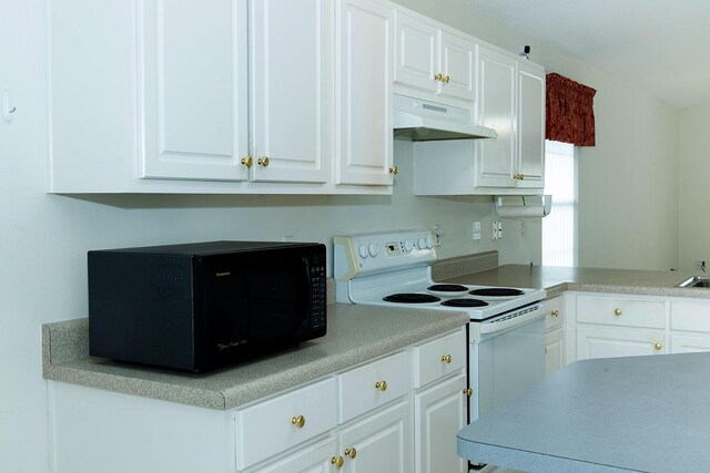 kitchen featuring white cabinetry and white electric range oven