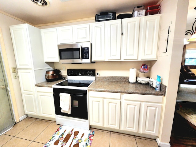 kitchen featuring light tile patterned floors, electric stove, white cabinetry, and ornamental molding