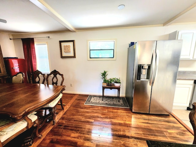 dining space with hardwood / wood-style flooring