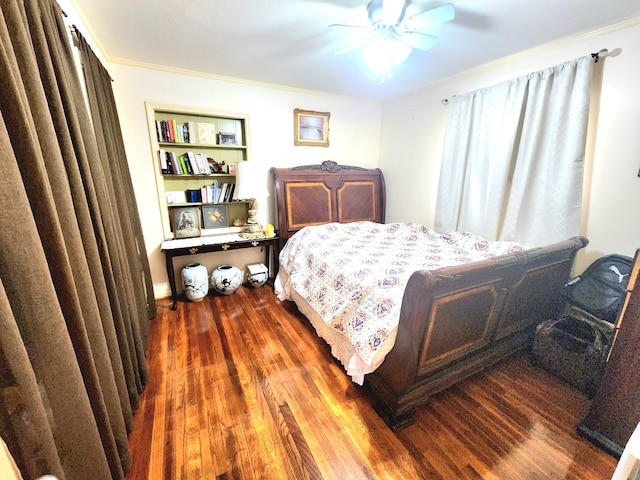 bedroom featuring crown molding, ceiling fan, and dark hardwood / wood-style floors