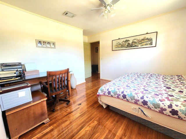 bedroom featuring ceiling fan, dark hardwood / wood-style flooring, and ornamental molding