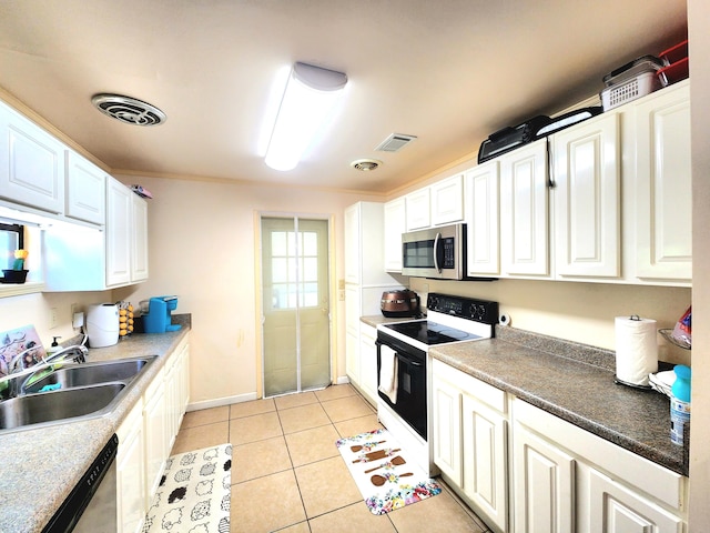 kitchen featuring white cabinets, light tile patterned flooring, stainless steel appliances, and sink