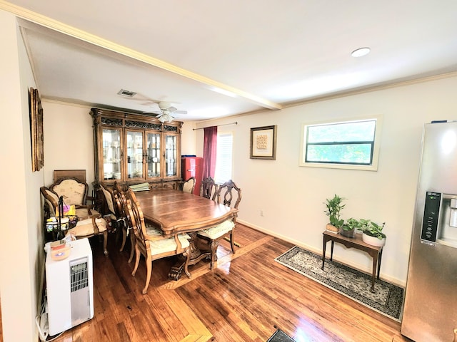 dining room featuring ceiling fan, ornamental molding, and hardwood / wood-style floors