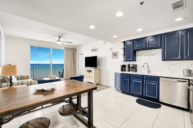 kitchen with sink, blue cabinets, dishwasher, and ceiling fan