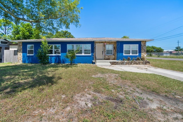 ranch-style house with a front lawn