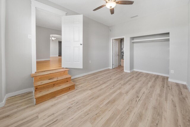 unfurnished bedroom featuring ceiling fan, light wood-type flooring, and a closet