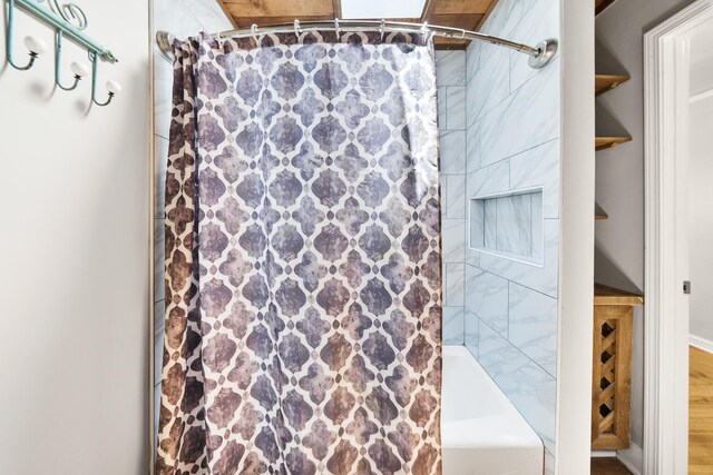 bathroom with shower / bath combination with curtain