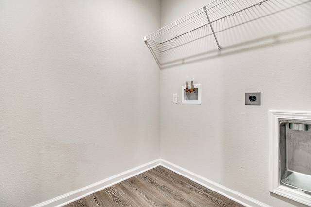 laundry area with electric dryer hookup, hardwood / wood-style flooring, and hookup for a washing machine