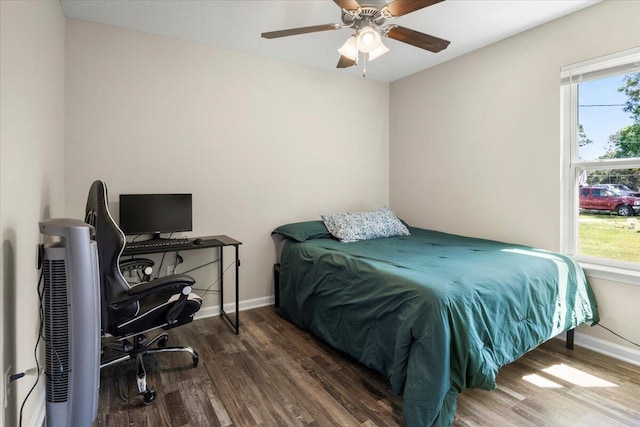 bedroom featuring ceiling fan and dark hardwood / wood-style flooring