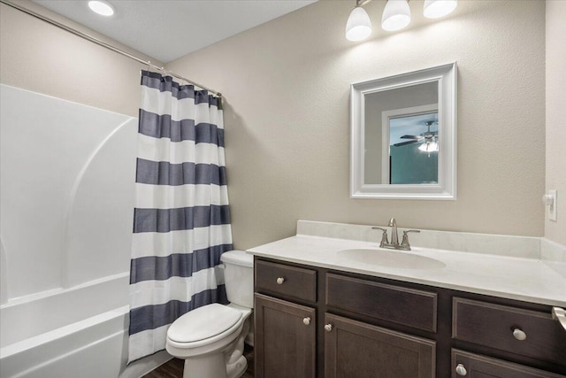 full bathroom with shower / tub combo, vanity, and toilet