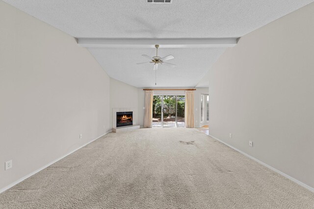 unfurnished living room with carpet flooring, ceiling fan, a textured ceiling, and vaulted ceiling with beams