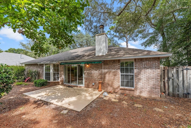 back of house with a patio