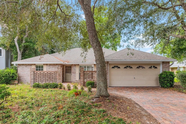 single story home featuring a garage