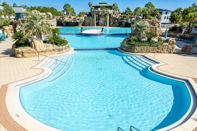 community pool featuring a patio area