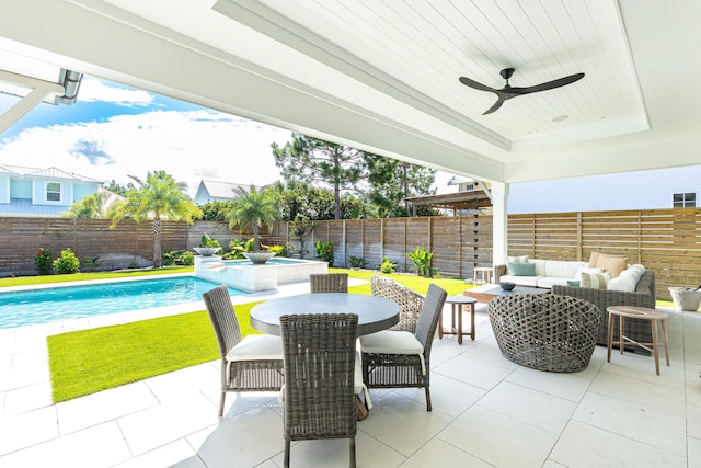 view of patio with a fenced in pool, a fenced backyard, ceiling fan, and an outdoor hangout area