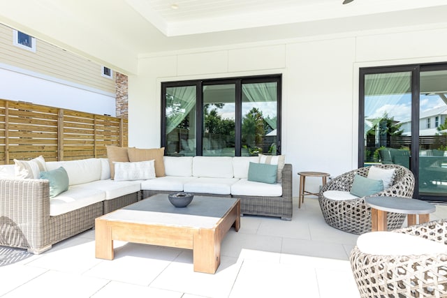 view of patio / terrace with outdoor lounge area and fence