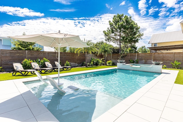 view of swimming pool with a fenced backyard, a patio, a fenced in pool, and an in ground hot tub