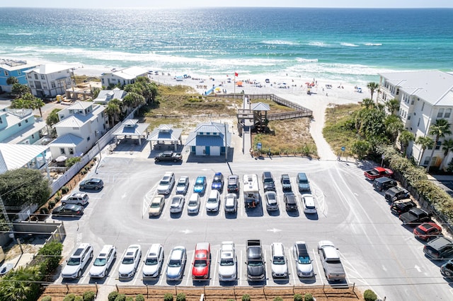 bird's eye view with a water view and a view of the beach