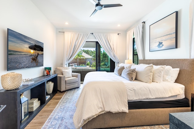 bedroom featuring a ceiling fan, wood finished floors, and recessed lighting