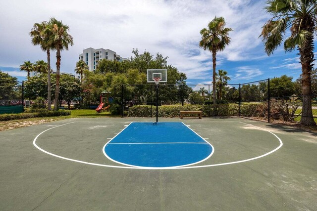 view of sport court featuring a playground