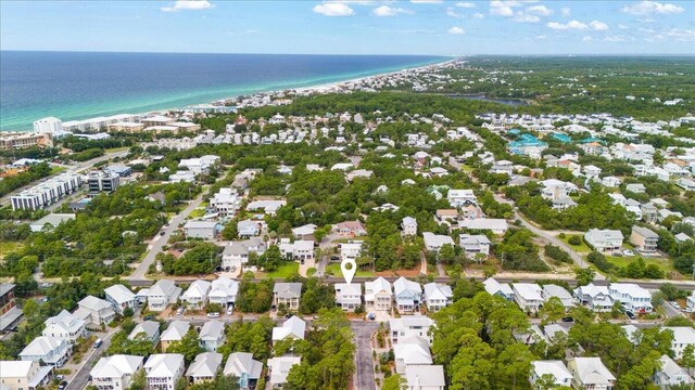 drone / aerial view featuring a view of the beach and a water view