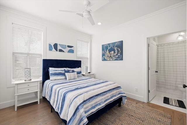 bedroom featuring ceiling fan, dark hardwood / wood-style floors, and ornamental molding