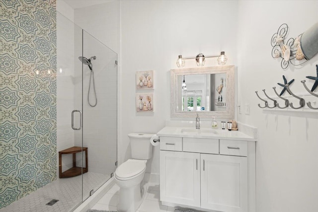 bathroom with vanity, toilet, an enclosed shower, and tile patterned flooring