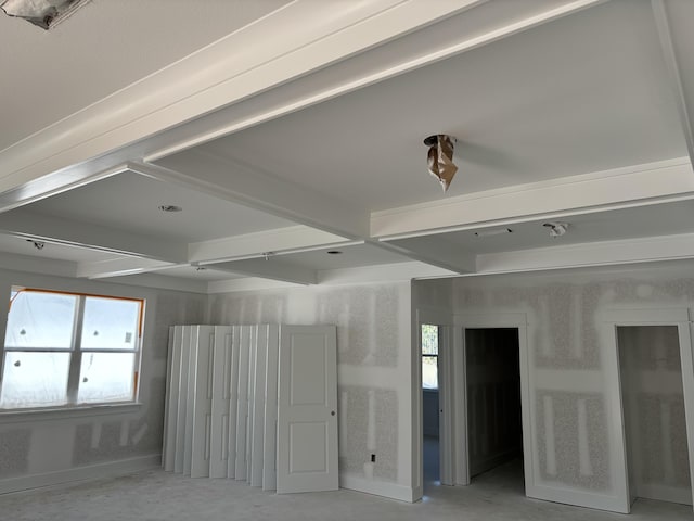 empty room with beam ceiling