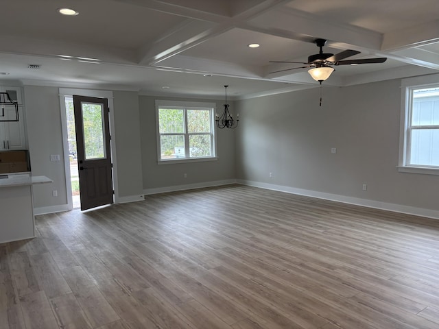 interior space with ceiling fan with notable chandelier, coffered ceiling, baseboards, and light wood finished floors