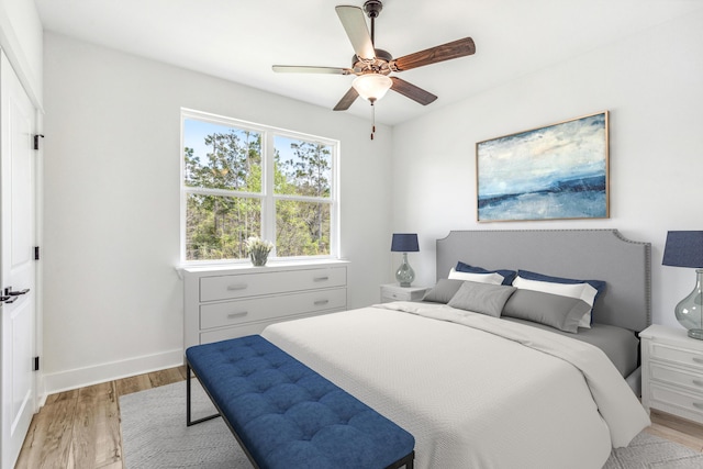 403 Bear Creek Blvd, Freeport, FL 32439 - bedroom featuring light wood-style floors and a ceiling fan