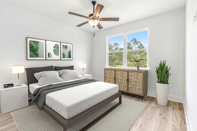403 Bear Creek Blvd, Freeport, FL 32439 - bedroom with light wood-type flooring and a ceiling fan