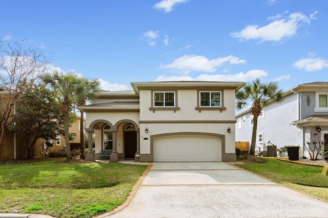 mediterranean / spanish house featuring a garage, a front yard, and central air condition unit