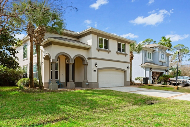 mediterranean / spanish home featuring a garage and a front lawn