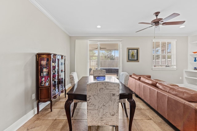 dining area with ceiling fan and ornamental molding