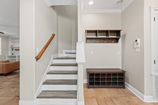 staircase featuring crown molding