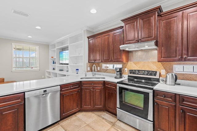 kitchen with ornamental molding, appliances with stainless steel finishes, sink, and kitchen peninsula